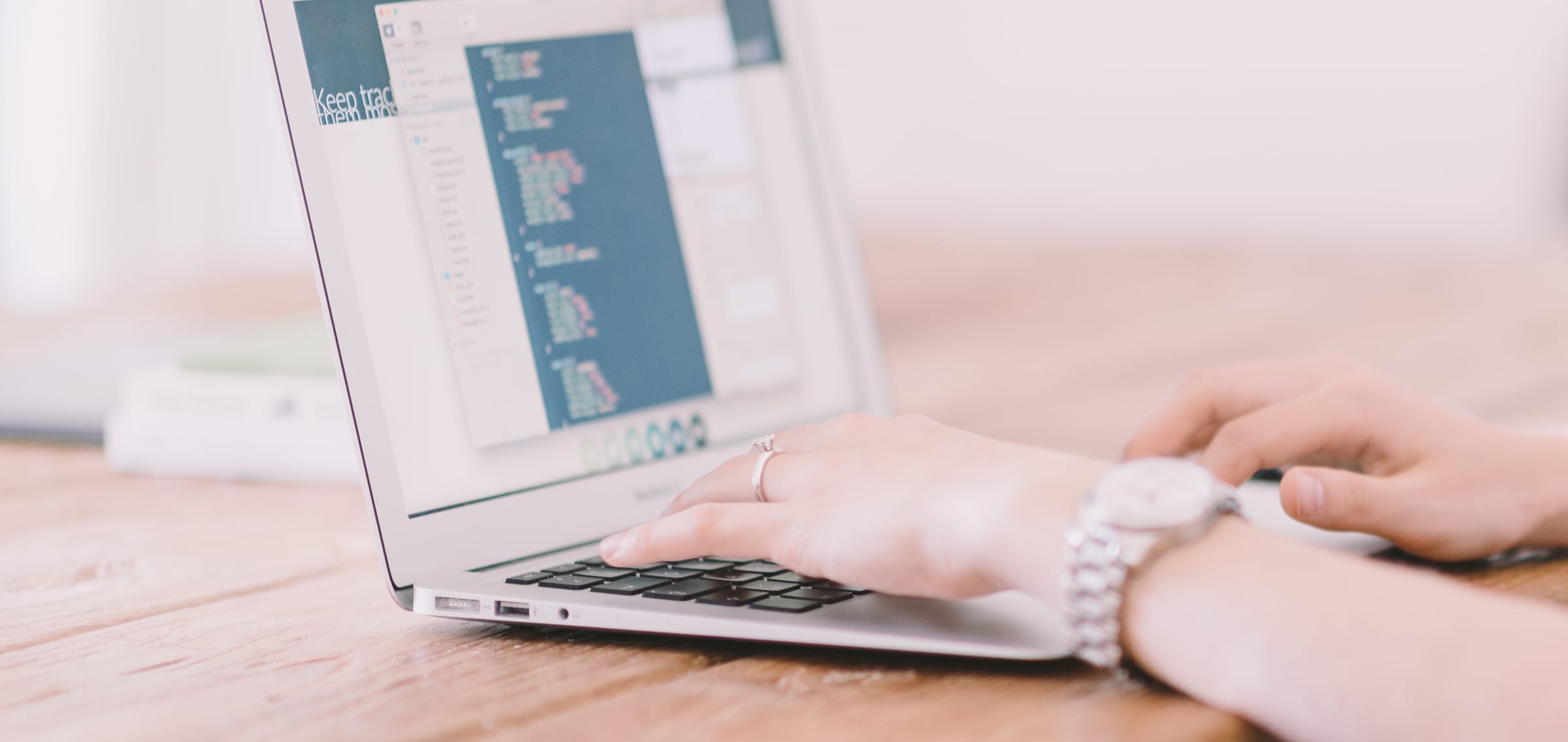 People coding on a laptop